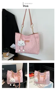 Pink large tote bag with silver star prints and plush cloud pendant detail view