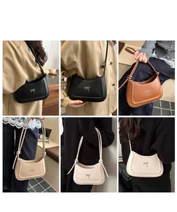 Detail showing variety of minimal crescent underarm bags with bow accent and rope strap