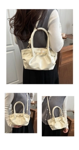 Detailed views of a cream white glossy tote bag showing the handle and crossbody strap