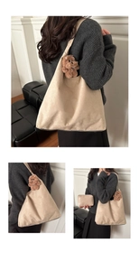 Detail of beige suede tote bag with small pouch and plush teddy bear charm pendant