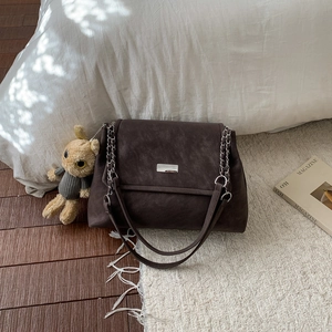 Dark brown matte leather shoulder bag with silver buckle and cute bunny pendant charm