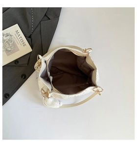 Top view of white star pattern tote bag showing spacious brown interior and gold rings