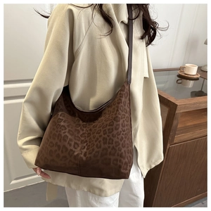 Detail of leopard print tote bag with soft suede texture and durable shoulder strap