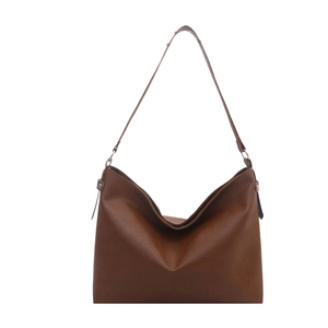 Brown vintage faux leather hobo bag with adjustable shoulder strap and metal rings