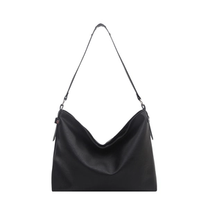 Classic large black leather tote bag for women featuring a minimalist design and shoulder strap