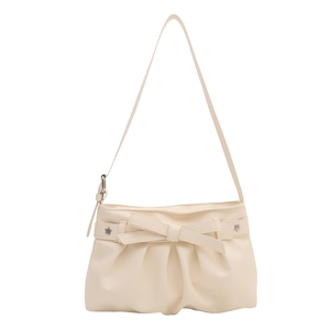 Cream white PU leather shoulder bag with bow and silver star studs on plain white background