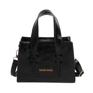 Large capacity black tote bag with gold lettering and adjustable shoulder strap