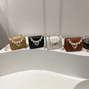 Mini woven crossbody bags in four colors with pearl handles and heart metal buckles