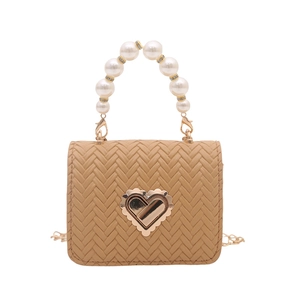 Chic woven crossbody bag with heart-shaped metal clasp and elegant pearl handle