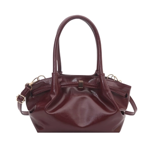 Deep wine red shiny leather bucket bag with top handle and adjustable shoulder strap