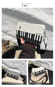 Close-up of piano key pattern on rectangular crossbody bag with I Love Music print