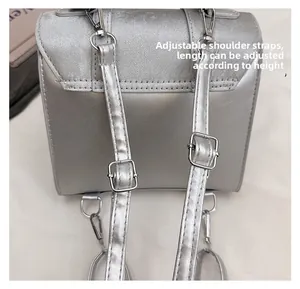Detail of adjustable silver backpack straps with metal buckles and reinforced stitching