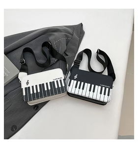 Creative piano keyboard crossbody bag featuring I Love Music print and adjustable strap