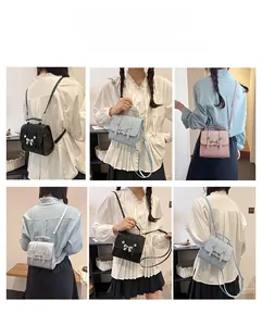 Detail showing versatile butterfly accent handbag with backpack and crossbody options