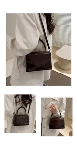 Close-up of the glossy wine red patent leather shoulder bag with top handle and flap