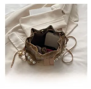 Detailed view showing the spacious interior of a brown crossbody bucket bag