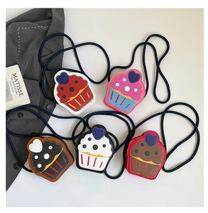 Flat lay view of creative cupcake shaped mini crossbody bags in five assorted colors