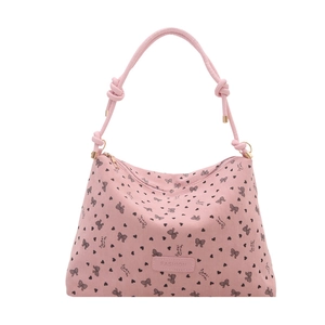 Pink corduroy tote bag with heart and bow print featuring thick rope shoulder straps