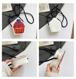 Detail of creative cupcake-shaped girls crossbody bag with blue rope strap and zipper