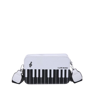 Chic black and white piano keyboard rectangular crossbody bag with musical note print