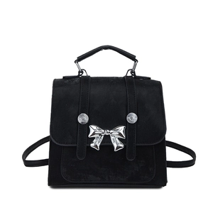 Fashionable black matte backpack featuring a metallic silver butterfly bow detail