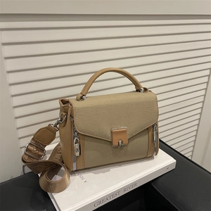 Fashionable khaki patchwork canvas handbag with leather trim and adjustable strap