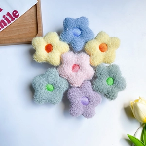 Star-shaped plush phone grip holder in assorted soft pastel colors on a white background