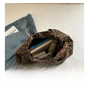 Interior view showing the large storage capacity of the leopard print canvas tote bag