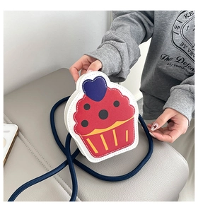 Detail of cupcake shaped crossbody bag with colorful PU leather and heart topper