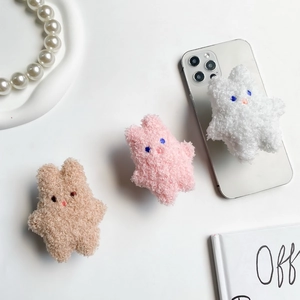Cute teddy plush star-shaped phone sockets in brown, pink, and white on white tray