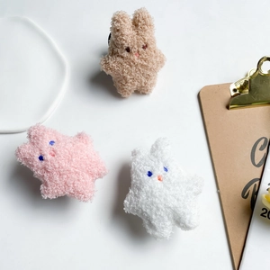 Cute plush bunny and star phone sockets in white, pink, and khaki soft fleece material