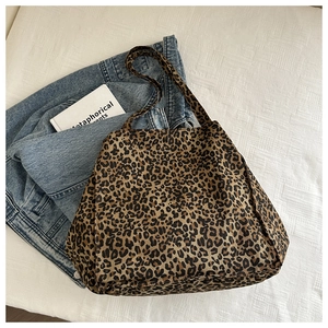Close-up of leopard print canvas tote bag with thick texture and spacious interior