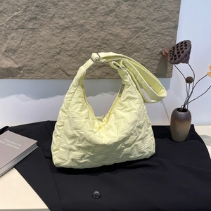 Lemon yellow star-quilted half-moon shoulder bag with wide adjustable strap for daily use