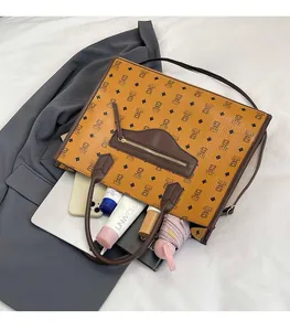 Detail shot of a large tote bag featuring vintage bear prints and a front zipper pocket