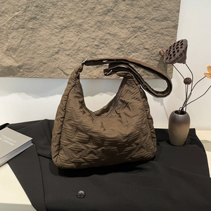 Deep brown quilted star pattern hobo shoulder bag with adjustable wide strap for daily use