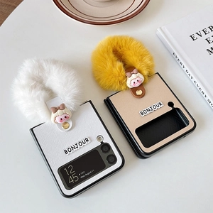 Detail of Galaxy Z Flip case with plush faux fur ring handle and cartoon ornament