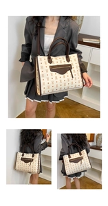 Detail view of beige tote bag featuring bear patterns and polished gold zipper pocket