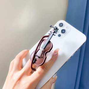3D violin shaped folding cell phone socket grip mount on white smartphone back