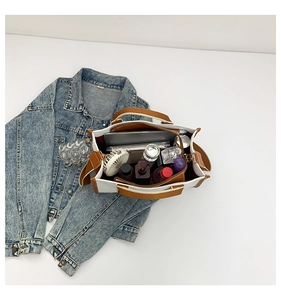 Interior view showing the large capacity and storage compartments of this canvas tote bag