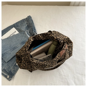 Spacious leopard canvas tote bag showing interior capacity for daily essentials
