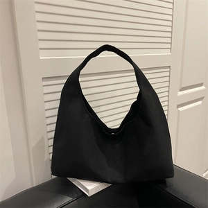 Minimalist black matte hobo bag with a natural curved structure for daily commuting