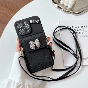Black quilted wallet phone case with silver bow and adjustable leather crossbody strap