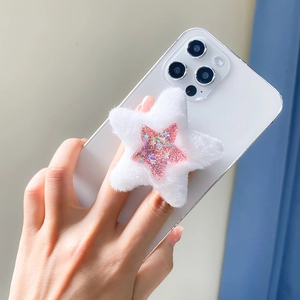 Detail of white plush star phone socket with pink sequin accent held by hand