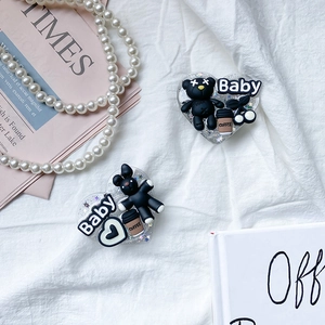 Detail of heart phone socket with 3D cartoon bear and Baby letters on silver glitter base