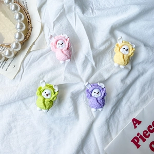 Detailed view of four colorful bunny phone sockets on a white textured background
