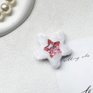Detail of plush star phone grip with pink sequins and white fur on a textured background