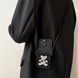 Crossbody iPhone case with houndstooth bear card holder and black leather shoulder strap