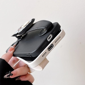 Detail showing precise cutouts and wide wrist straps on luxury leather phone cases