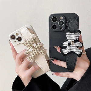 Protective iPhone case with teddy bear wrist strap in cream and black matte finish