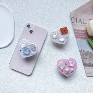 Heart-shaped expanding phone sockets with pearls and gemstones in pastel macaron colors